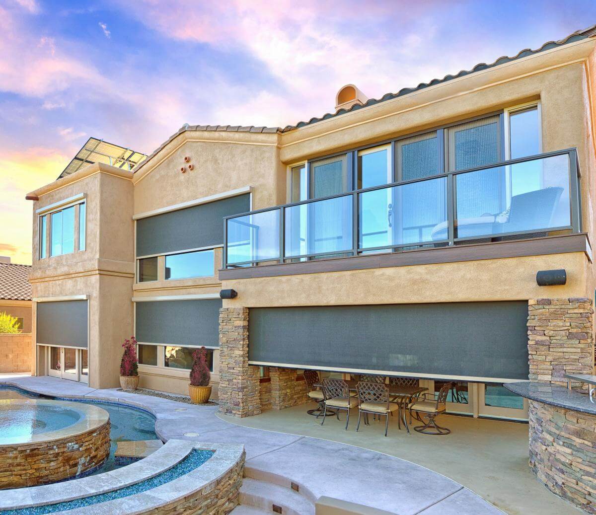 Outdoor patio with modern shades on windows, Dallas-Fort Worth home.