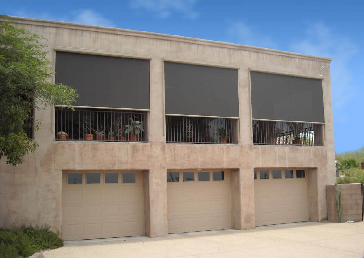 Building with exterior roller shades