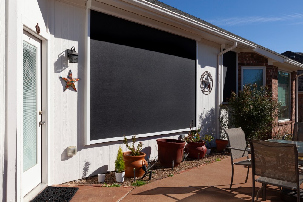 Exterior window screen covering patio door.