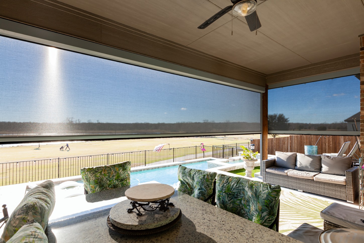 Patio with motorized outdoor screens in DFW.