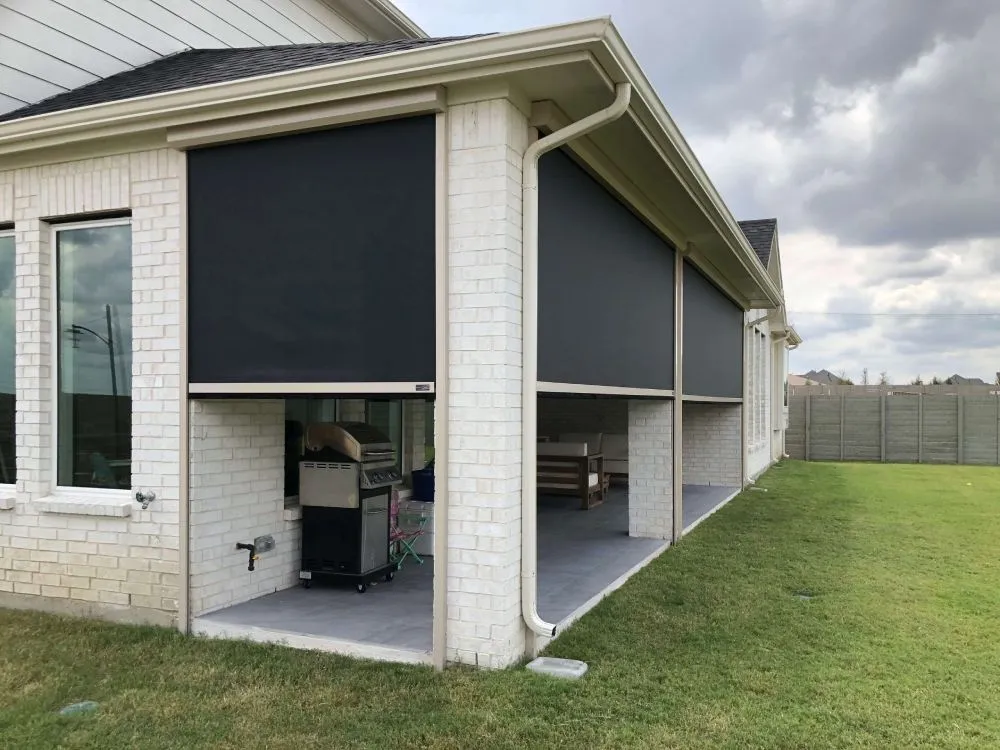 Patio with exterior roller shades.