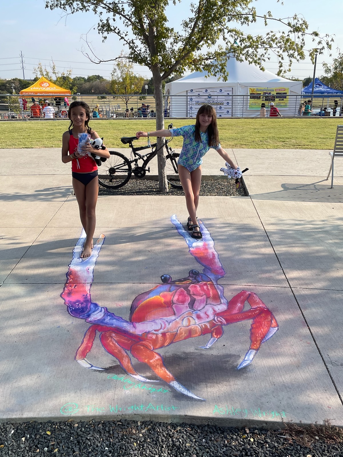 At the Flowapalooza wave boarding event in 2023, a stunning chalk painting stole the show—a colossal 3D giant crab emerging from the pavement. With intricate detail and clever perspective, the chalk art brought this sea creature to life, its claws raised in a dynamic pose as if ready to seize the waves. The vibrant colors and realistic shading created a sense of depth and movement, captivating spectators and adding an extra splash of excitement to the event's coastal atmosphere.