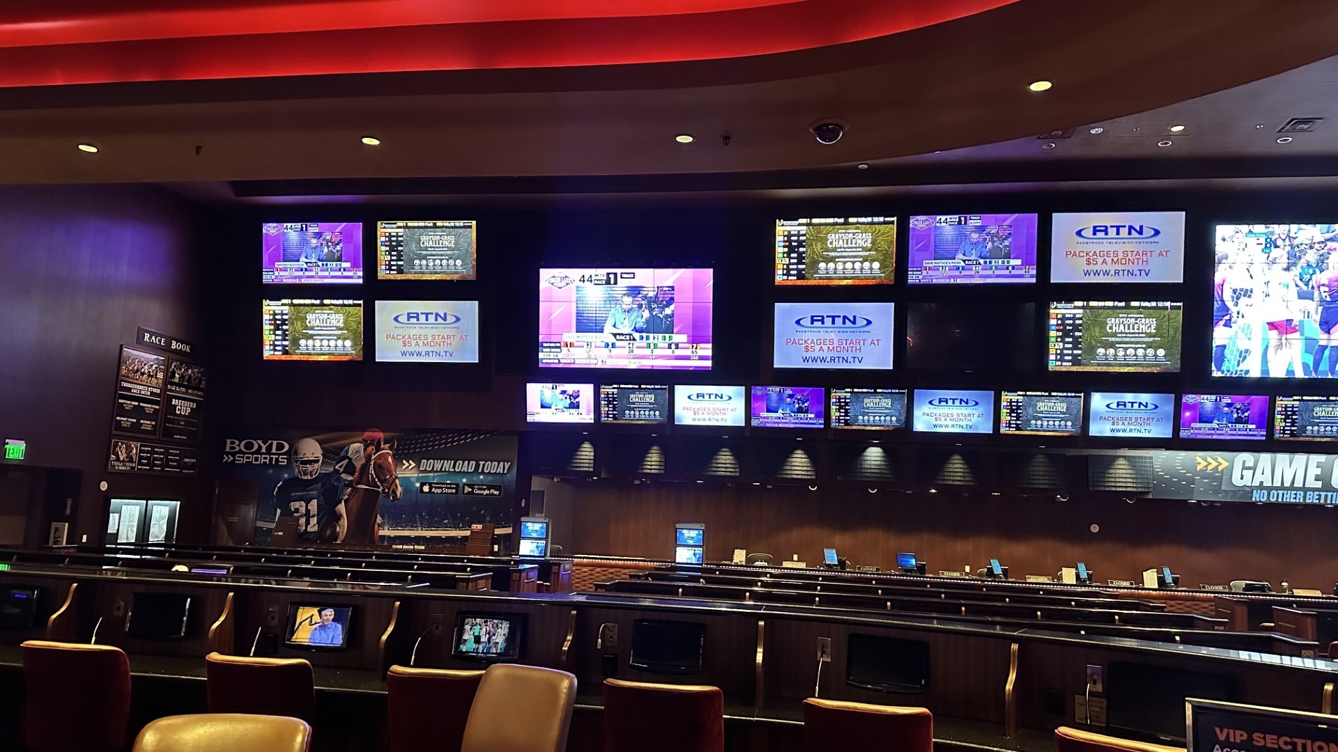 The Sam's Town sportsbook before the remodel — a wall of mismatched TVs replaced one at a time