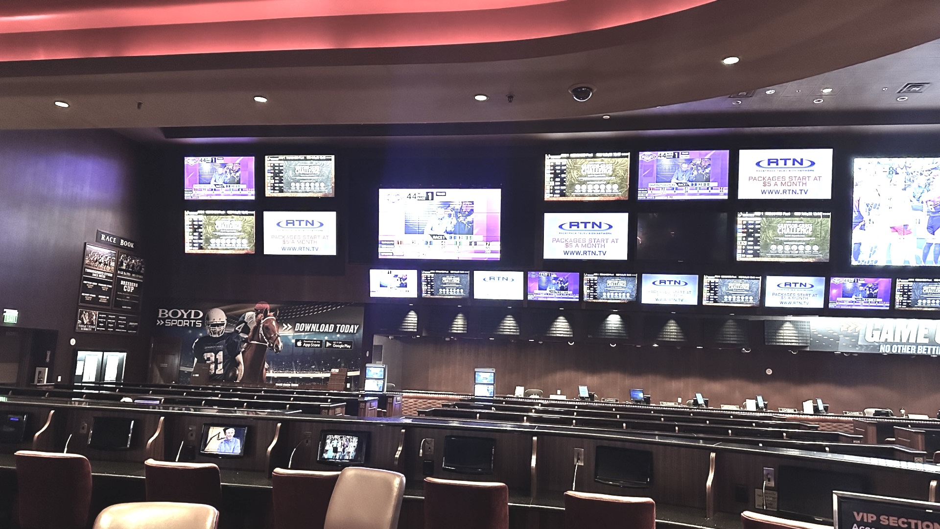 Sam's Town sportsbook before the remodel — tiered seating facing a wall of mismatched TVs