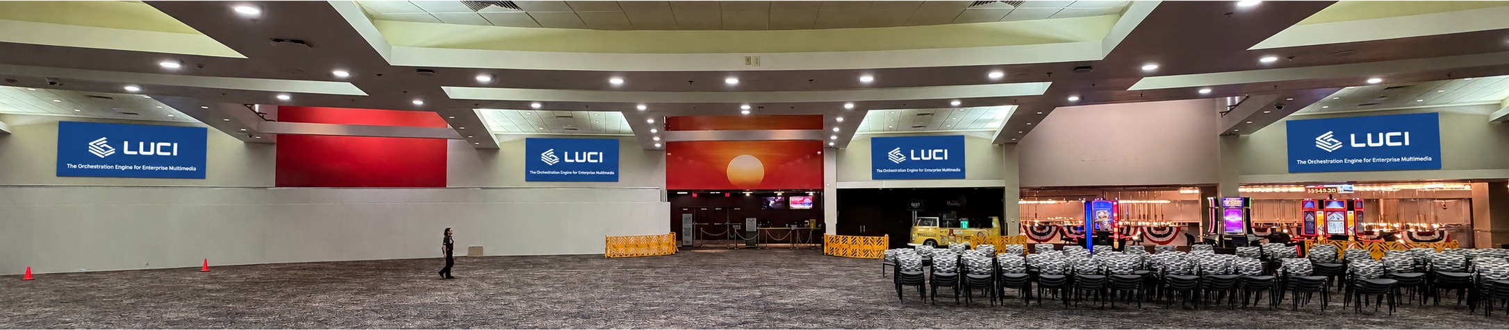 Wide view of the Tachi Palace bingo hall with eight LED walls installed across the room and LUCI displayed on multiple screens