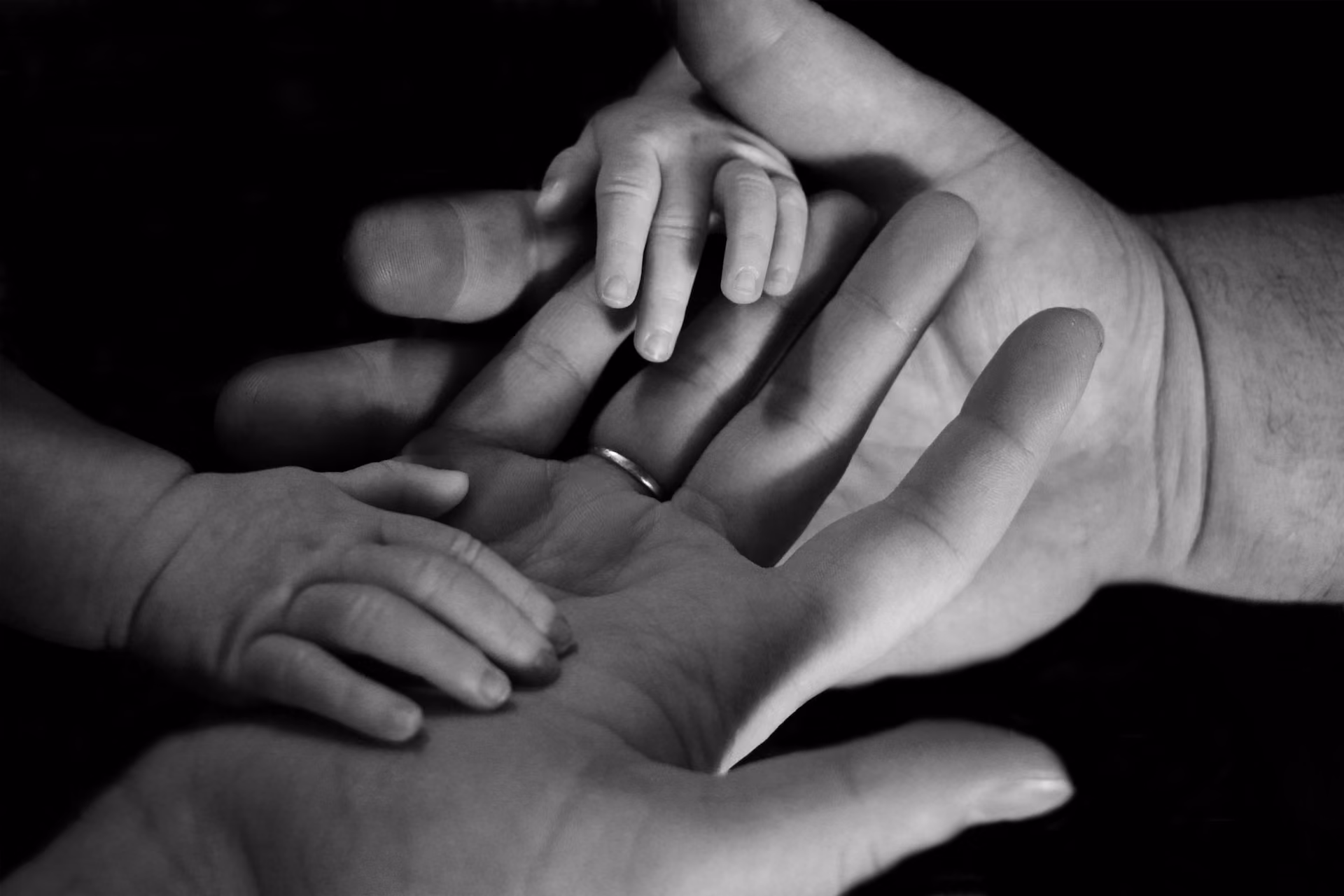 Child holding parent's hands