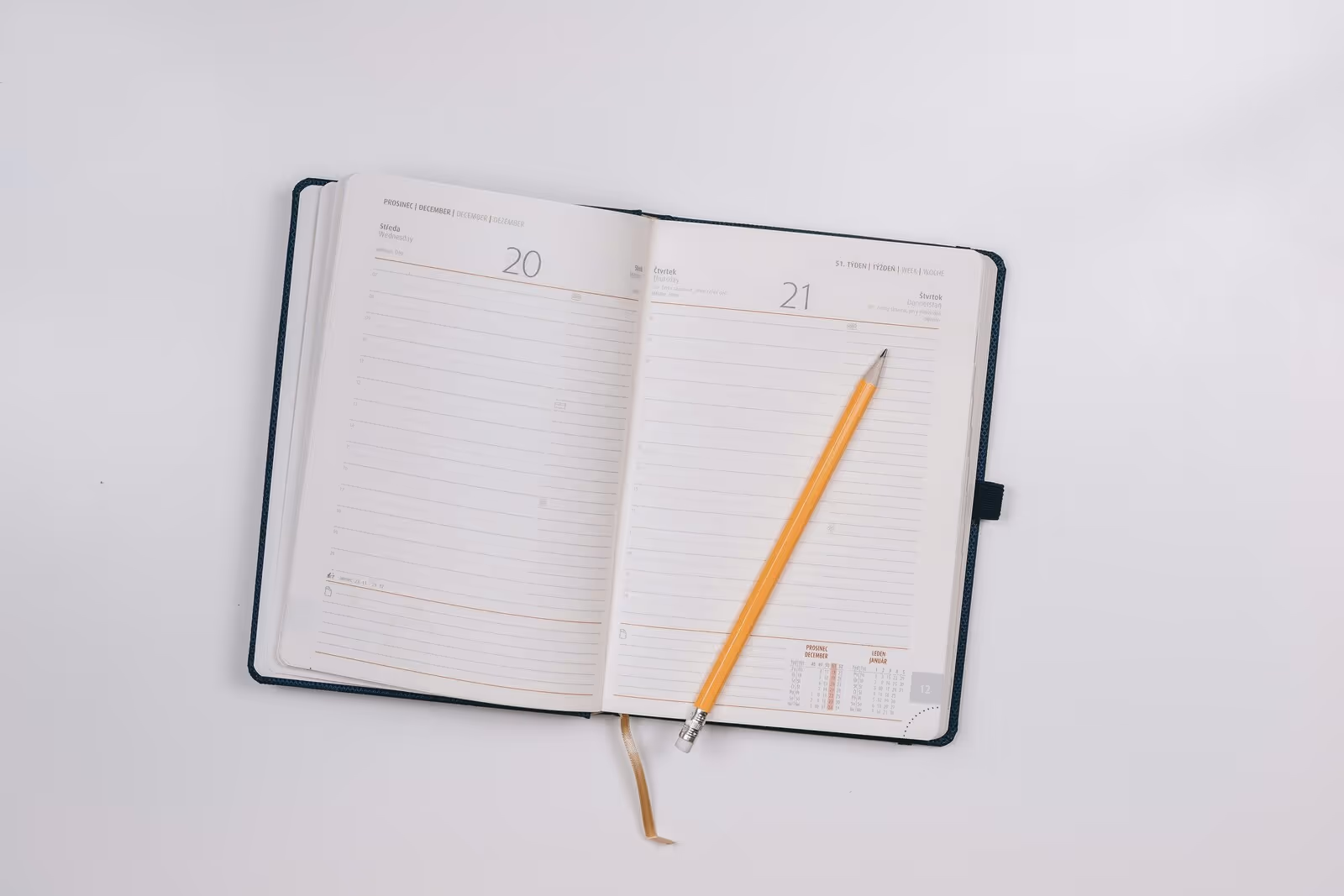 A planner is open to an empty page.