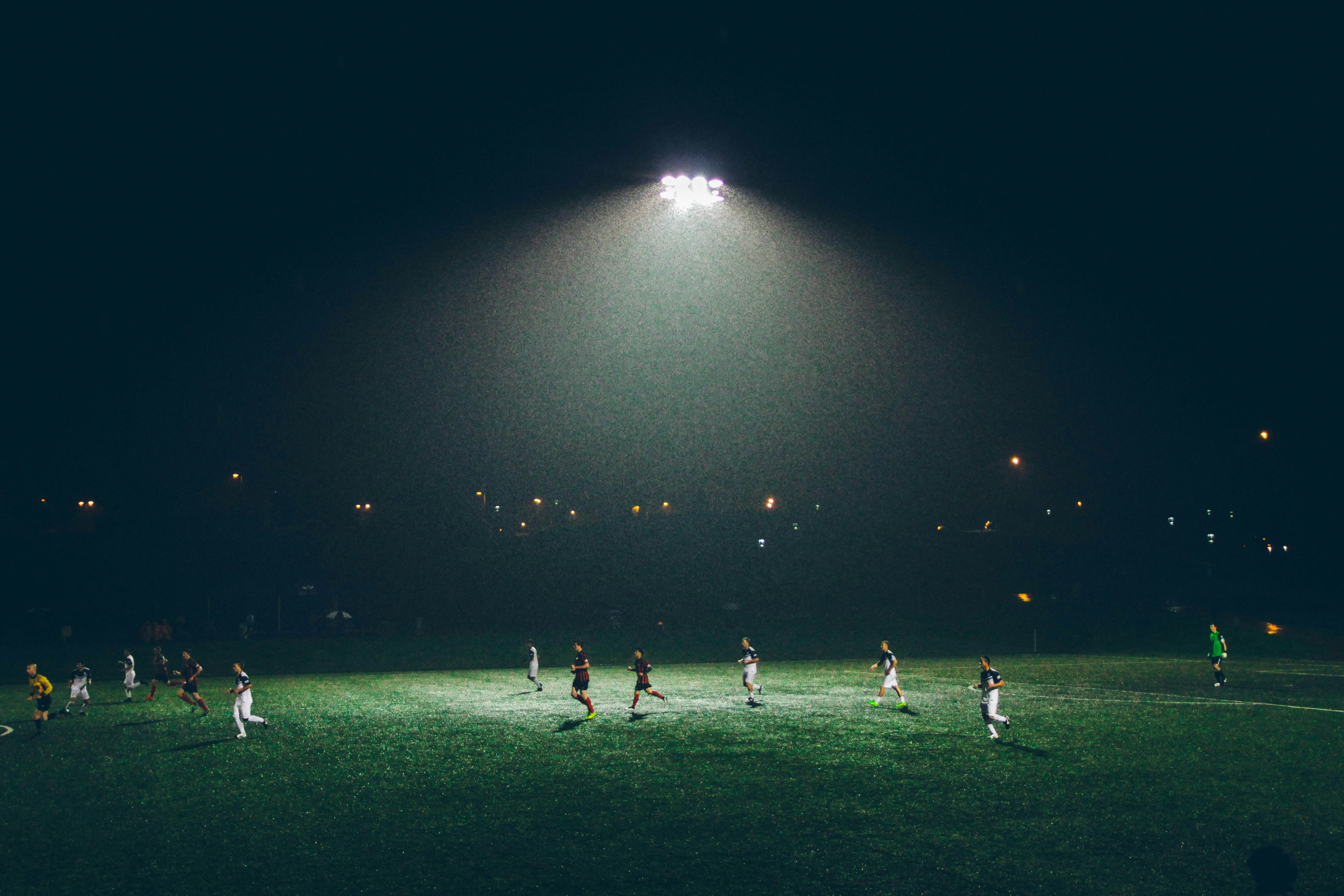 Players on football field