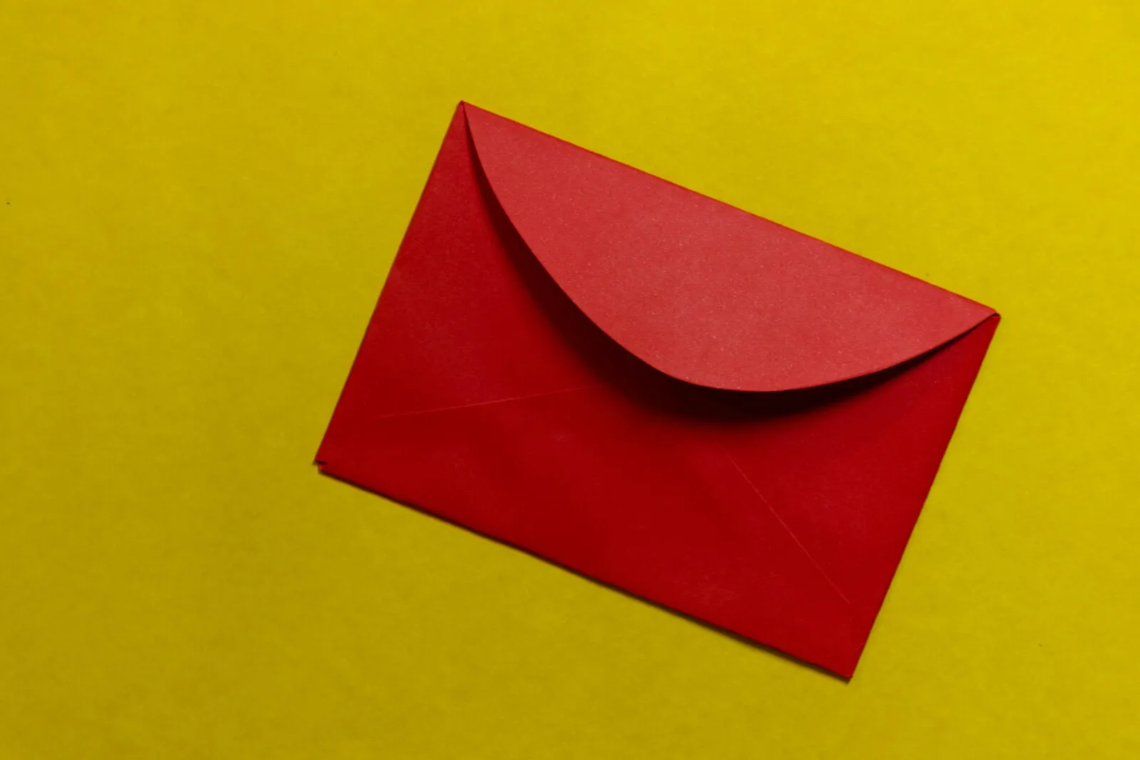 A red envelope against a yellow background.