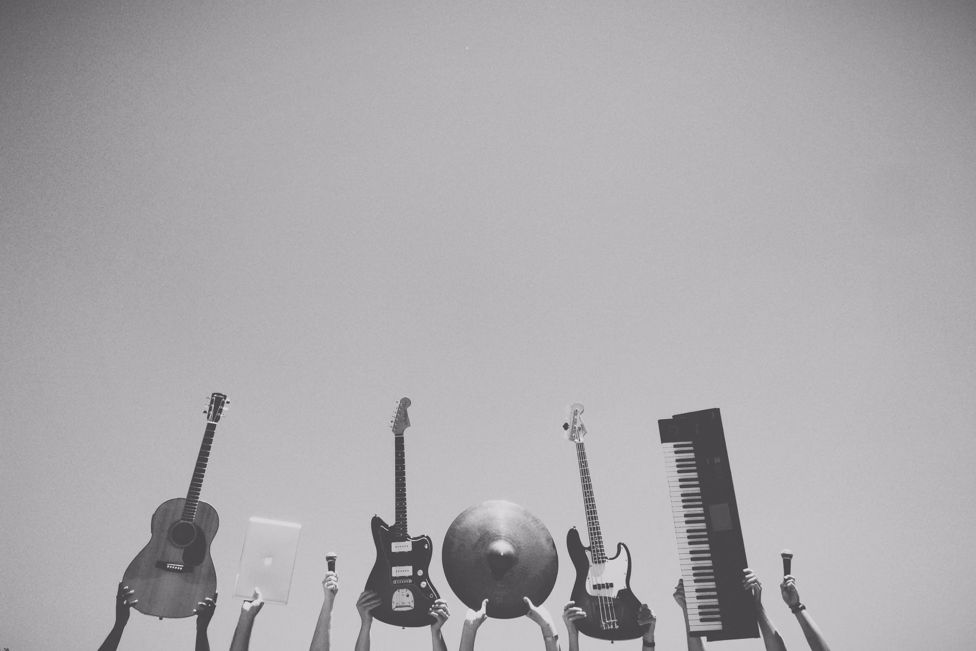 Black and white image of guitars and keyboard