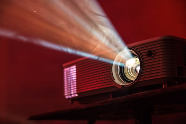 Projector on red background