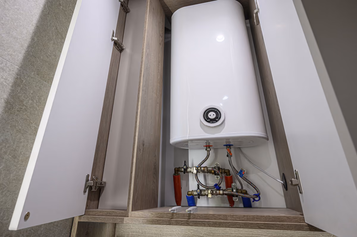 An example of a water heater in the cupboard.