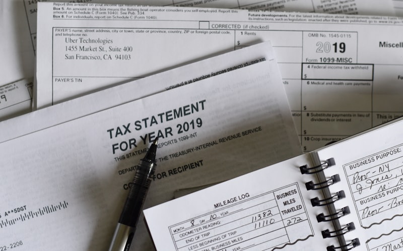 Tax documents and pen on a professional desk