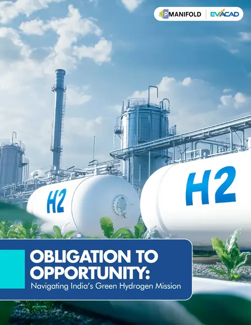 Industrial facility with large white hydrogen storage tanks labeled H2 under a blue sky with clouds.