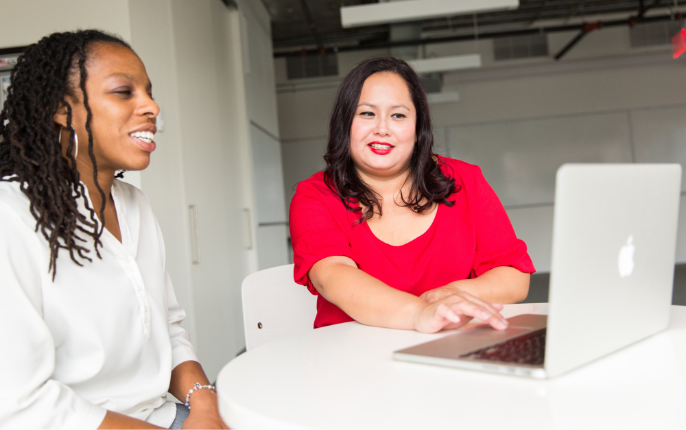 Two colleagues having a direct, respectful conversation about feedback
