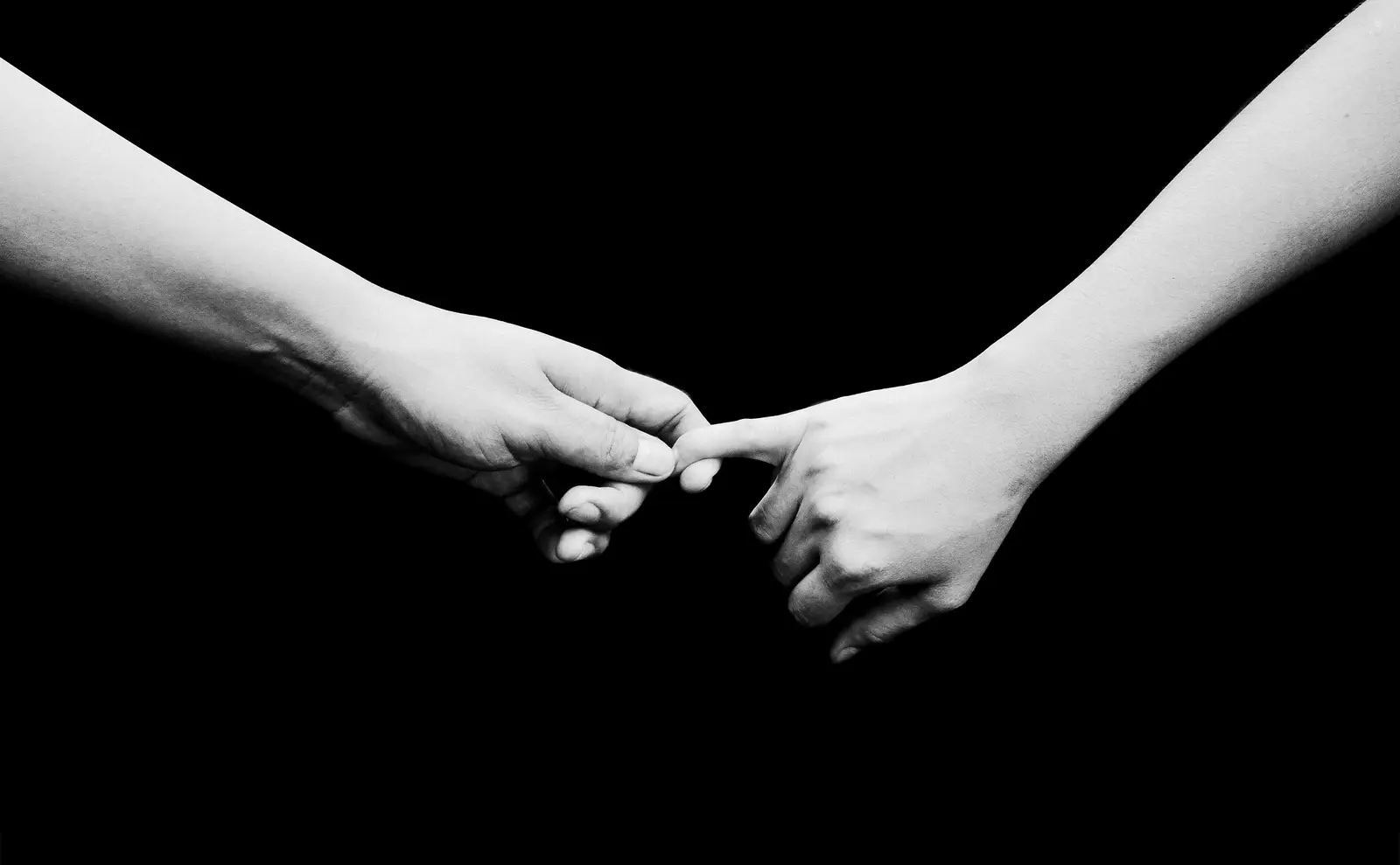 Picture of a parent holding the hands of their Adult ADHD child