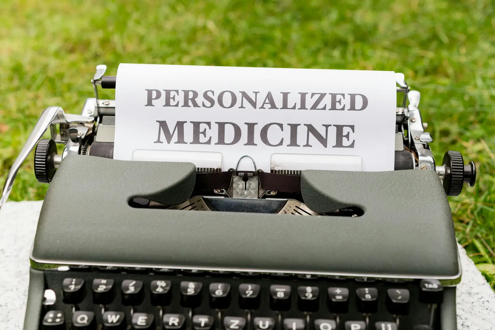 A typewriter producing in writing "personalised medicine" and this is the reason why we are recommending pharmacogenetic testing in ADHD