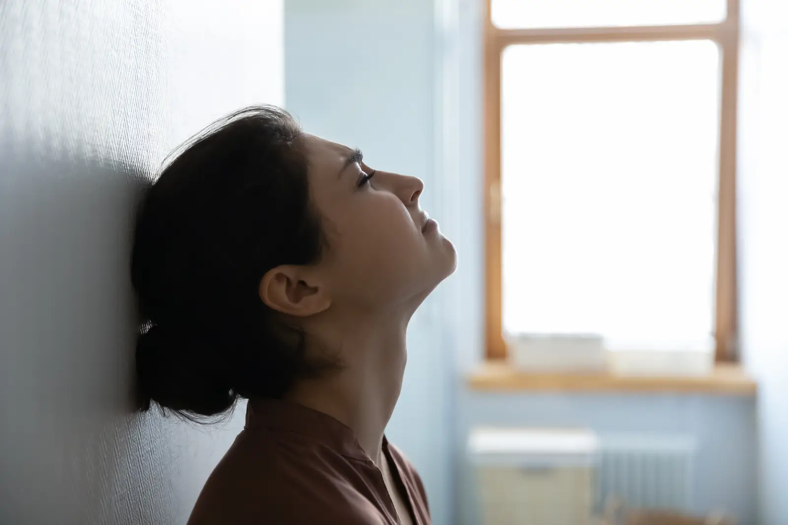 Picture of a frustrated and sad woman after the partner continues to suffer with an addiction relapse epsode.