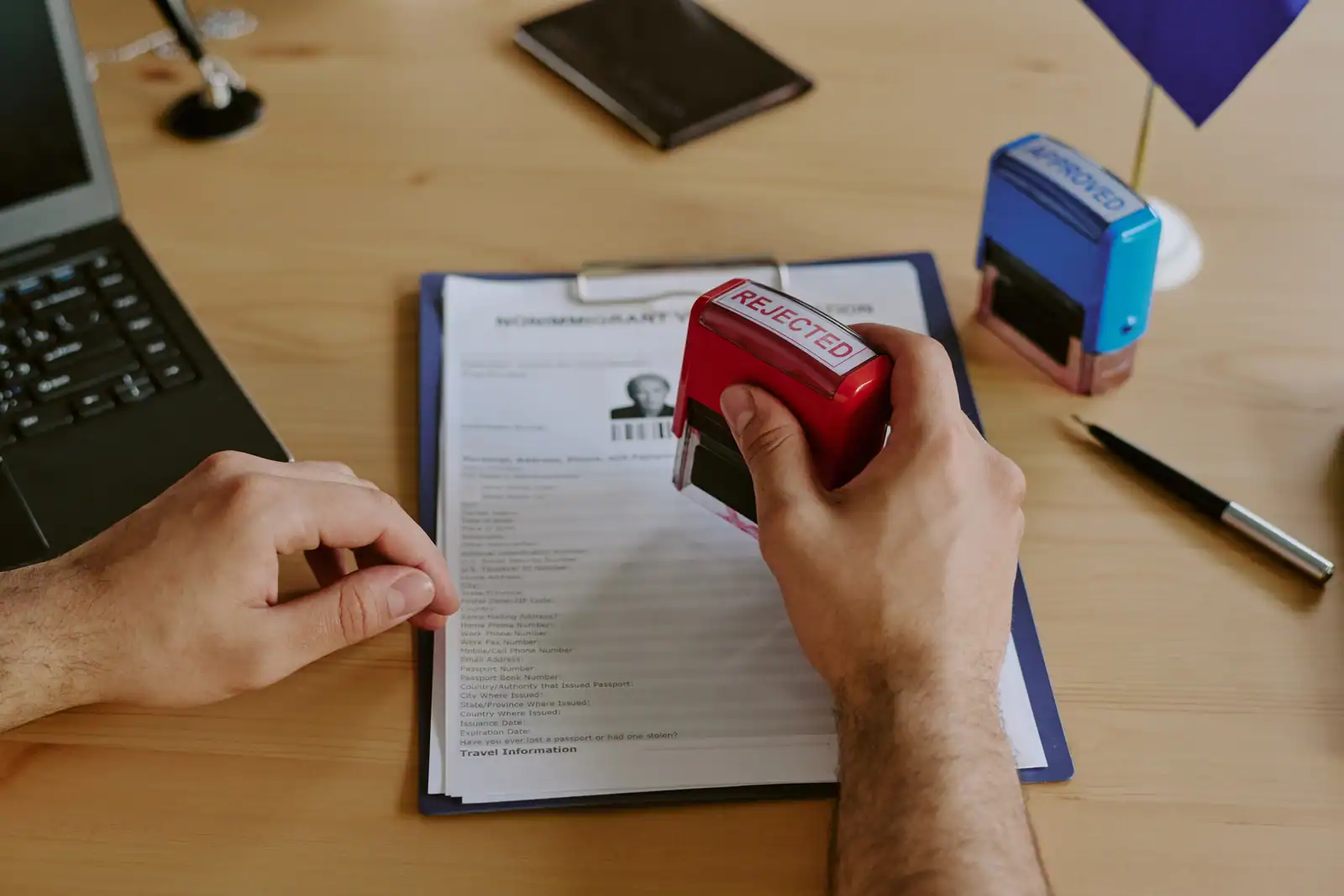 picture with a rejecting stamp ready to be applied on a document, in this case a shared care agreement.