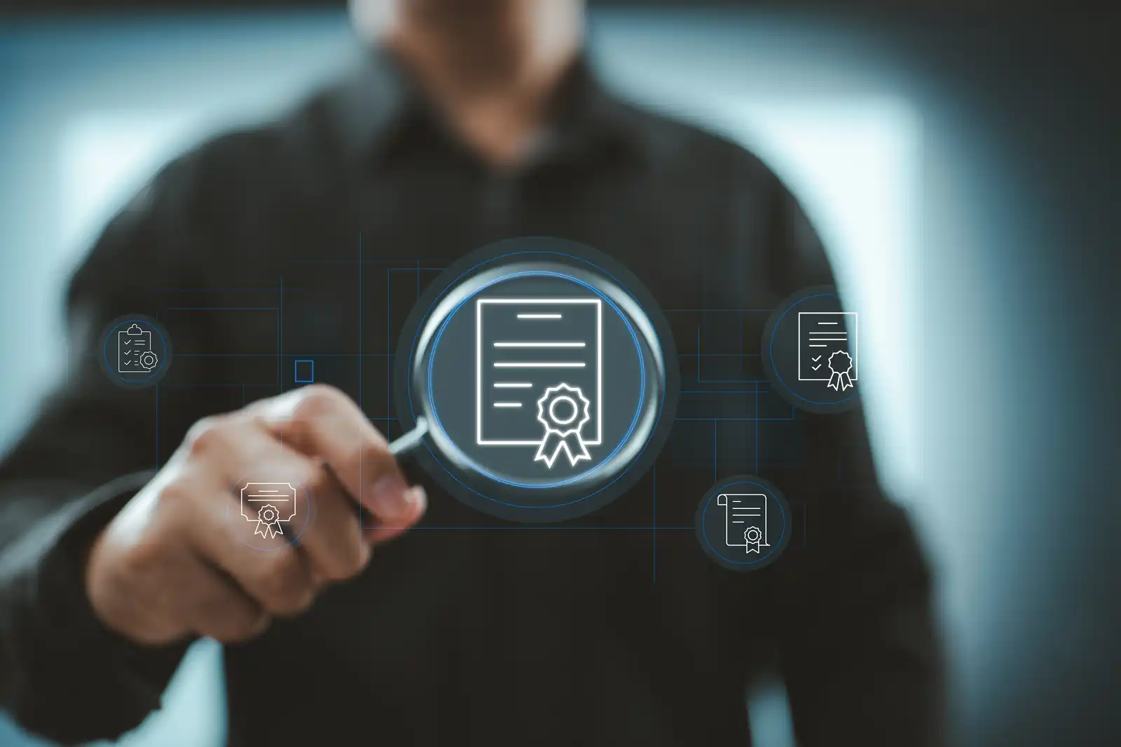 Modern picture of a man holding a loupe over a credential icon.  Suggesting the importance of checking credentials. 