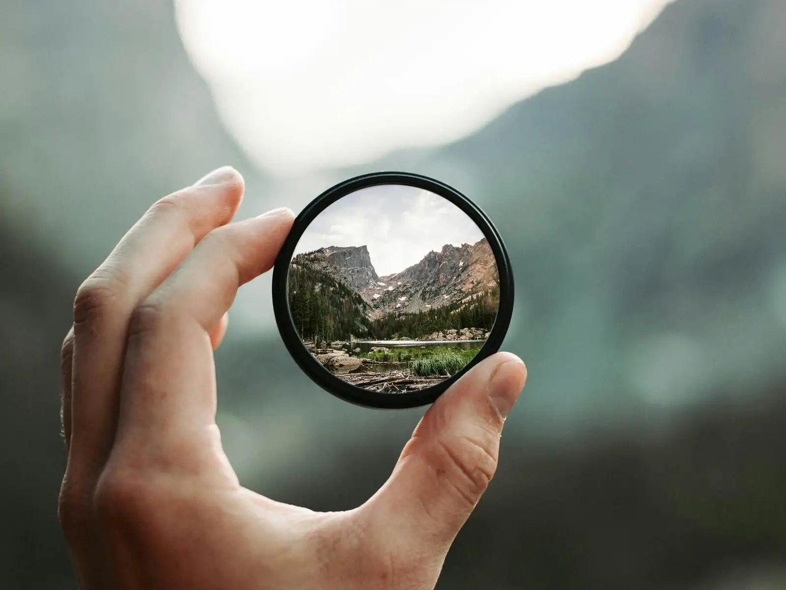image of a lens filter on a blurry landscape image being able to offer clarity for the user. Suggesting the importance to do your own due diligence when selecting your adhd specialist for the assessment and treatment.  