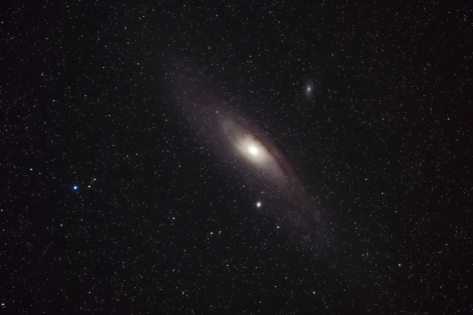 Picture of Andromeda Galaxy which suggests the high numbers, billions, trillions in the text