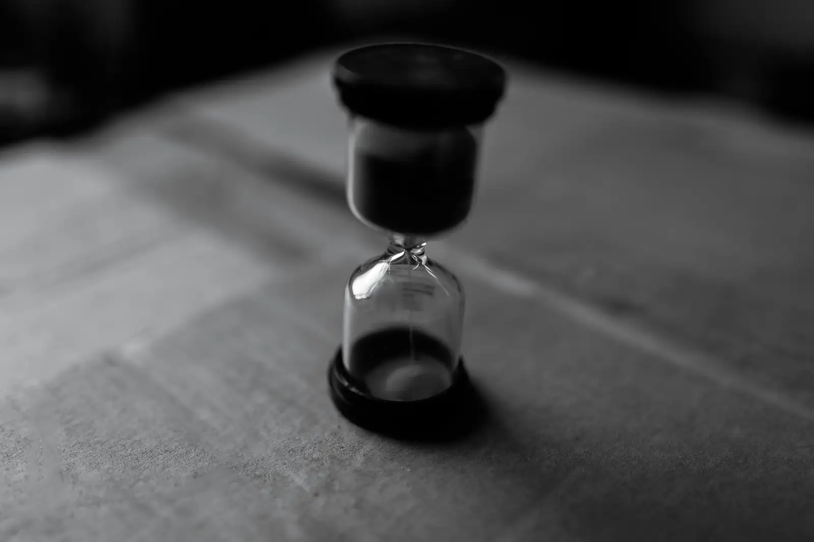 Black and white picture of a hour glass suggesting time and how limited this is.