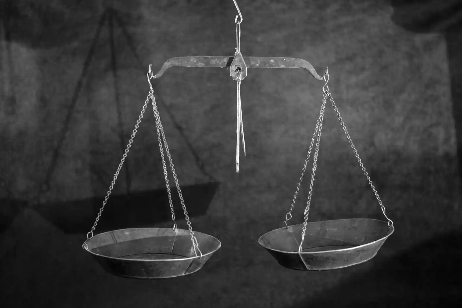 picture of a weight balance scale suggesting that you should be very cautious getting into debt when it comes to mental health. This can have negative repercussions on your recovery and stability.