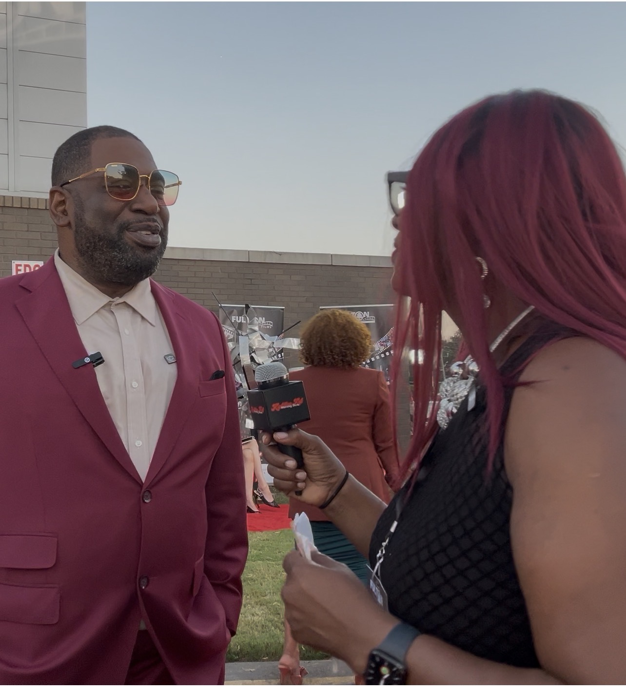 Kadillac Kat interviewing a guest on the red carpet