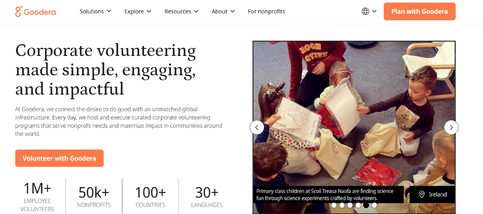 Goodera corporate volunteering banner featuring children participating in a science activity led by volunteers, with text highlighting impactful global volunteer programs.