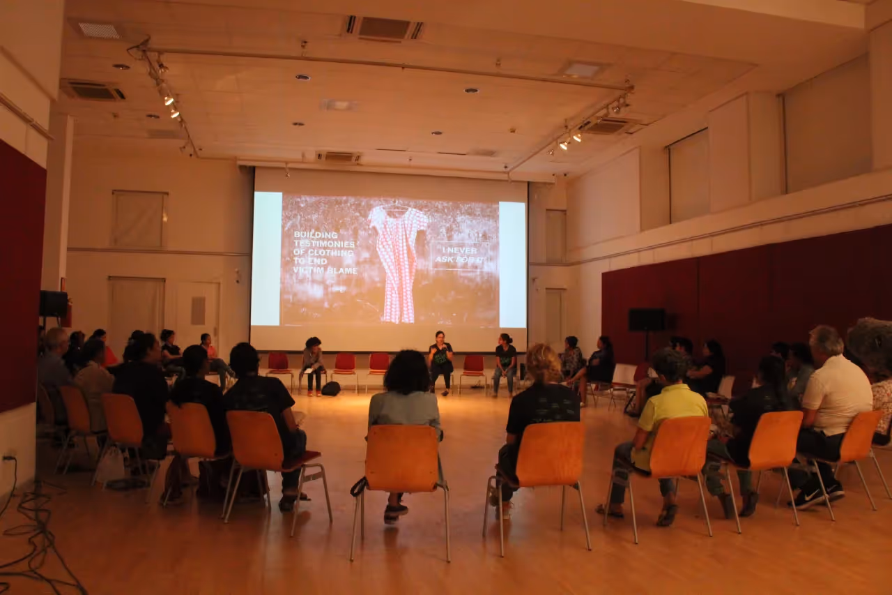 Group of employees sitting in a circle during a workplace discussion session focused on mental health awareness and open conversations
