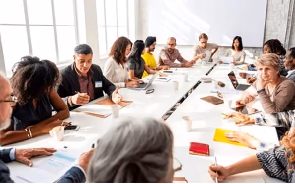 Team working through a brief at a table