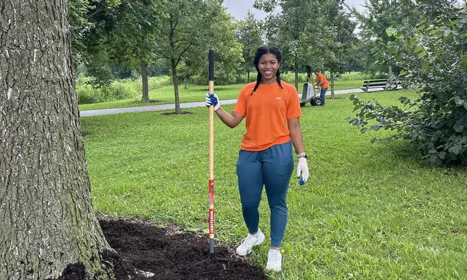Volunteers clearing and planting in a neighborhood park