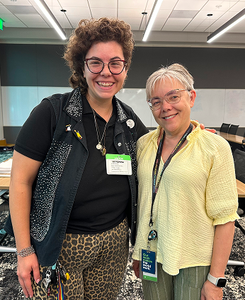 Two colleagues smiling together