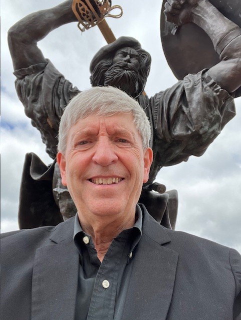 William Rothenbach stands in front of the PennWest Edinboro "Angus" statue. 