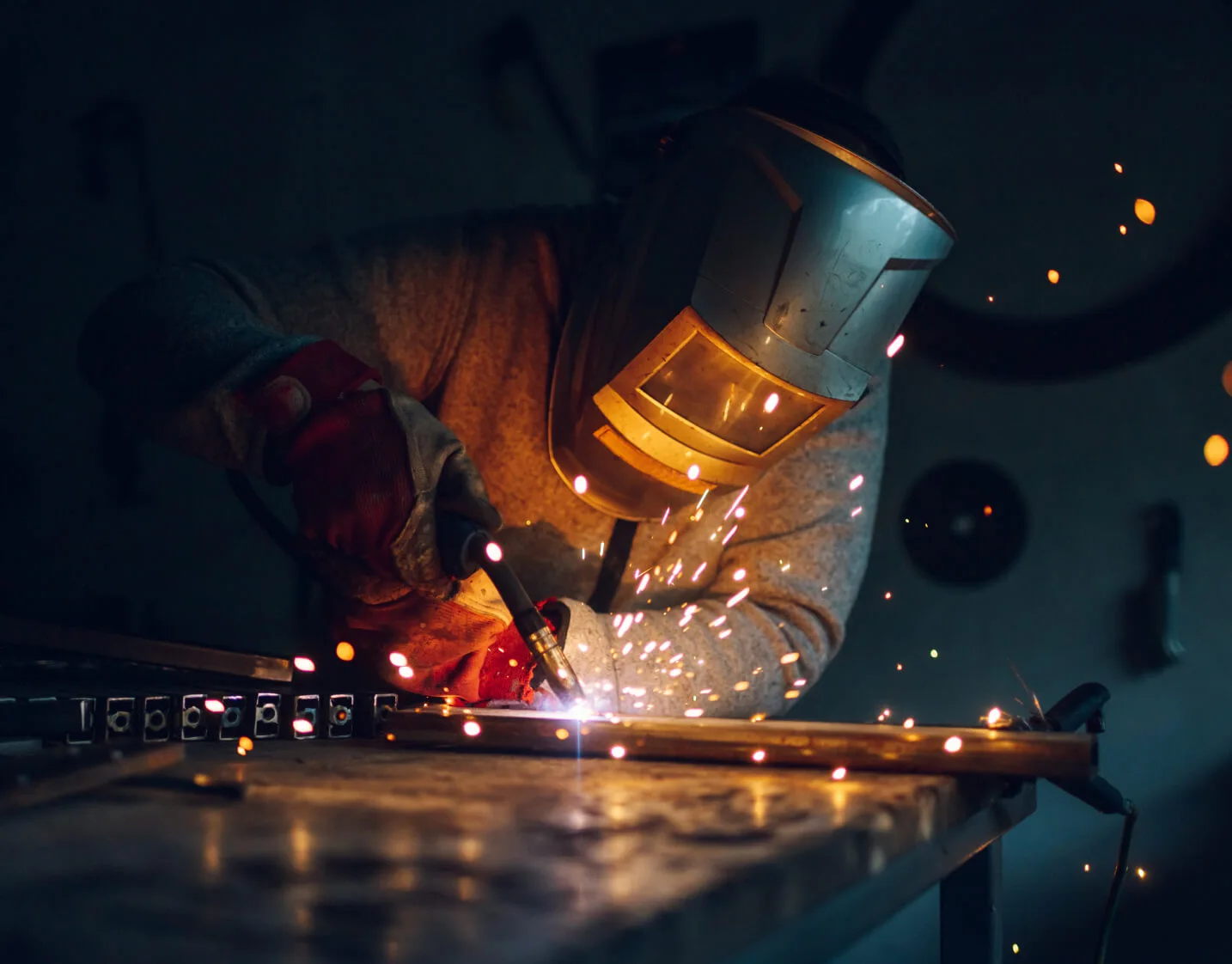 Welding a steel corner joint in the Prime Sukkah workshop