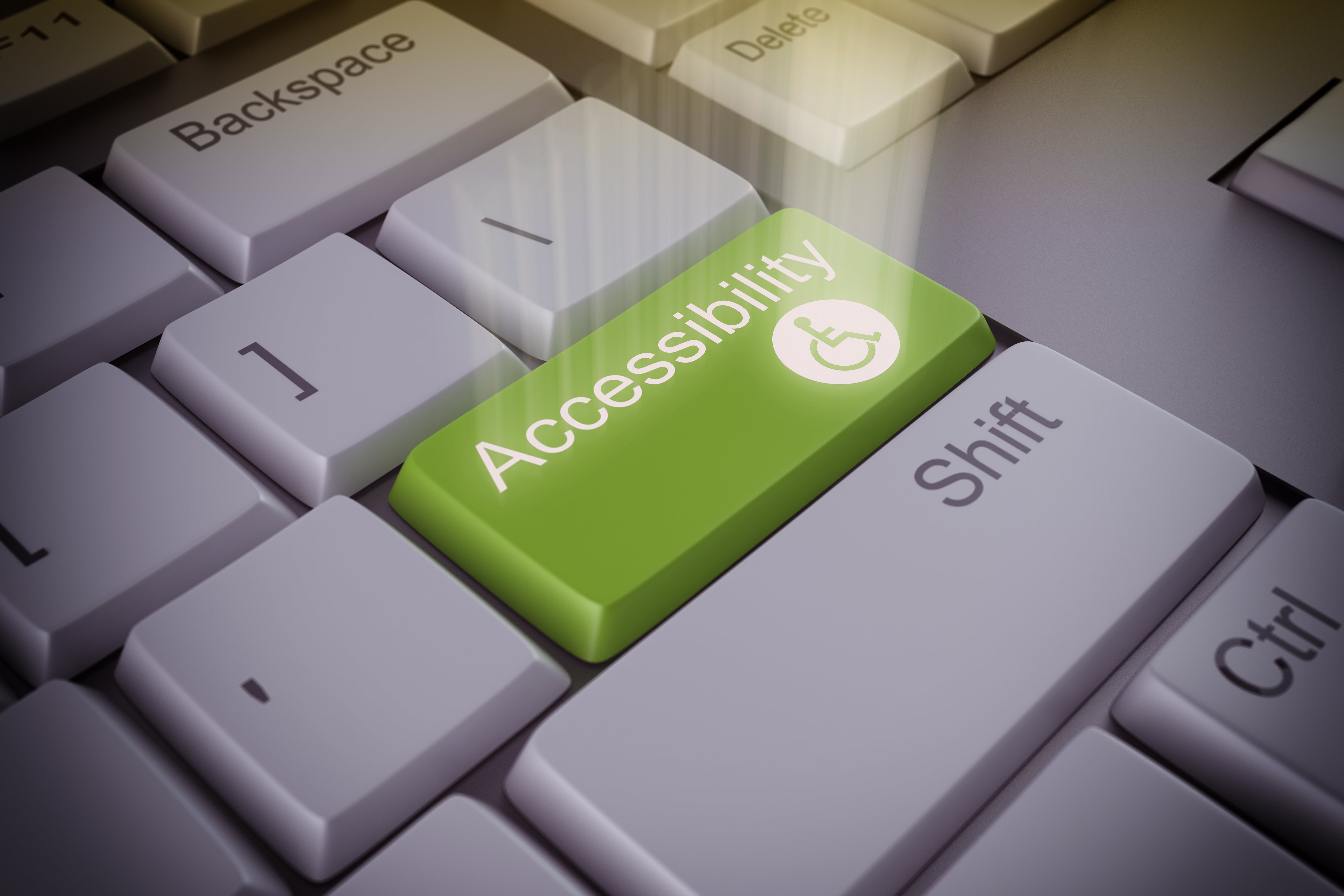 Una tastiera con il tasto "accessibility  verde