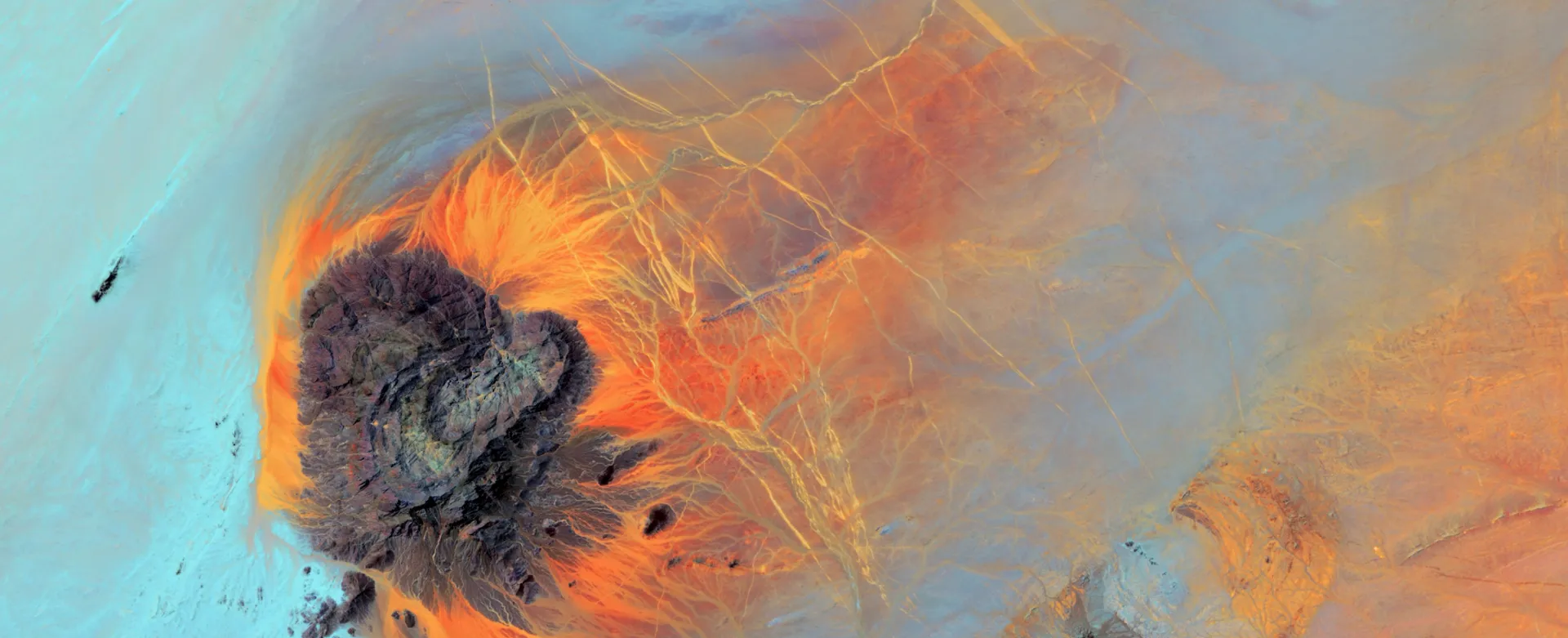 A satelite image of earth with turqoiuse and orange colors
