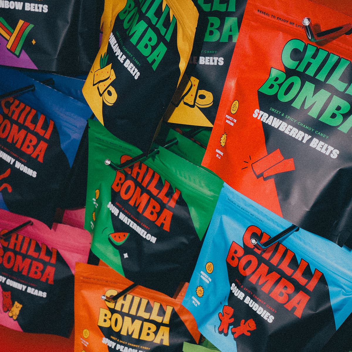 Chilli Bomba chamoy candy lineup with Spicy Mango Gummies, Sour Watermelon, Spicy Blasters, and Spicy Peach Rings, hand-made in LA
