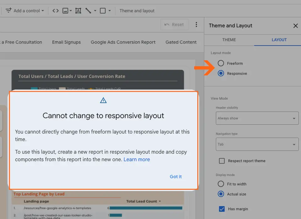The "Theme and Layout" settings of a dashboard, with the "LAYOUT" tab selected. The "Layout mode" section displays two options: "Freeform" and "Responsive," with "Responsive" currently selected. An orange arrow points to the "Responsive" radio button. An alert box titled "Cannot change to responsive layout" is overlaid, stating that direct switching from freeform to responsive layout is not currently possible and advising the user to create a new report in responsive layout mode and copy components. A "Got it" button is visible in the alert box.