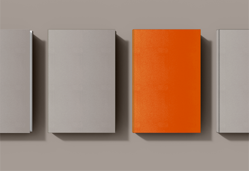 Gray books with 1 orange book to stand out