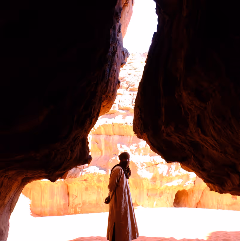 a person standing in a cave