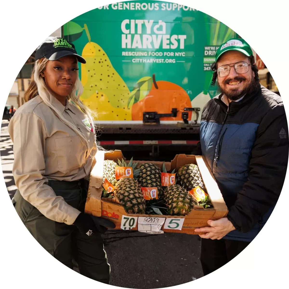 A City Harvest volunteer sharing food supplies