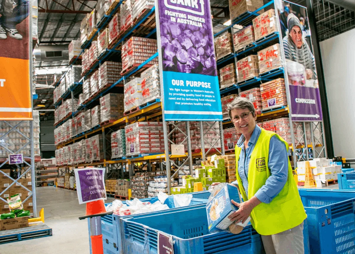 Foodbank volunteer packing meals for the local community