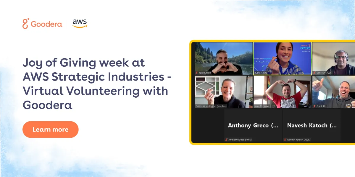 Goodera and AWS employees participating in Joy of Giving Week virtual volunteering event, shown in a Zoom call with smiling team members making heart signs.
