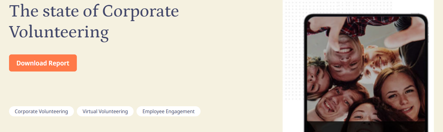 Banner titled “The State of Corporate Volunteering” with a Download Report button and a photo of six volunteers smiling in a close-knit group.
