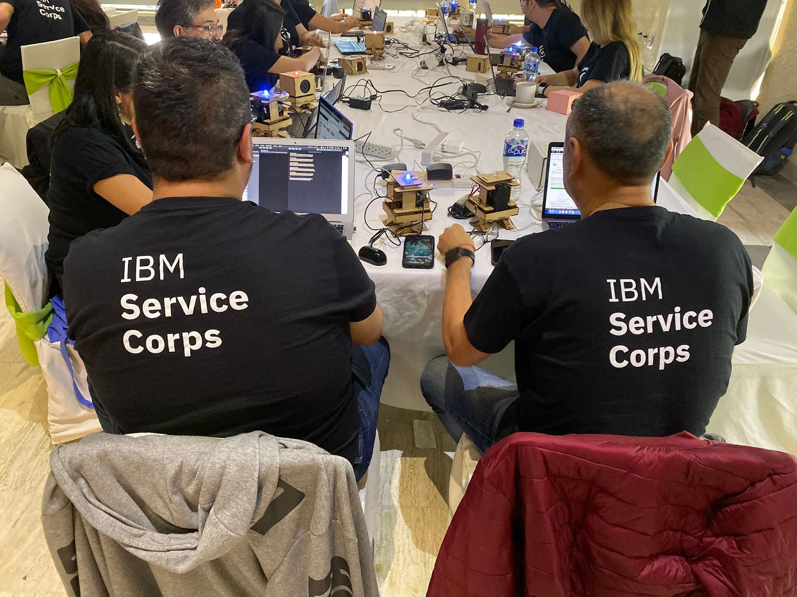 IBM Service Corps employees collaborating on a skills-based volunteering project