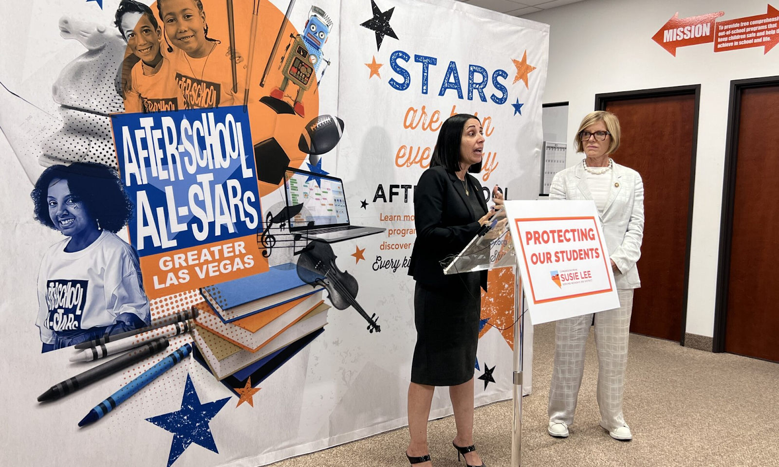 After School All Stars Las Vegas event with speakers standing before a branded literacy and student support backdrop.