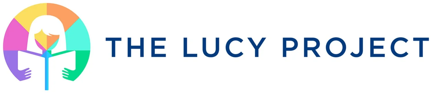 The Lucy Project logo featuring a child reading a book within a colorful circle symbolizing literacy and learning.