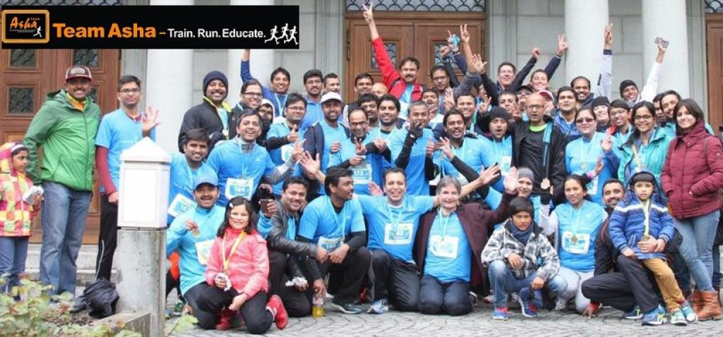 Volunteers participating in a Team Asha community run event supporting education initiatives in India.